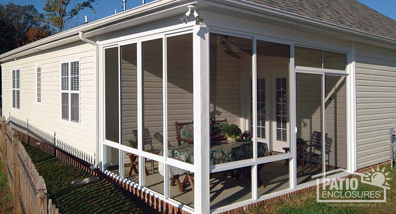 White screen room with knee wall enclosing existing covered patio.