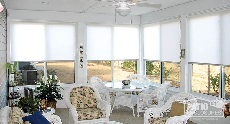 White roller shades provide privacy and control light.