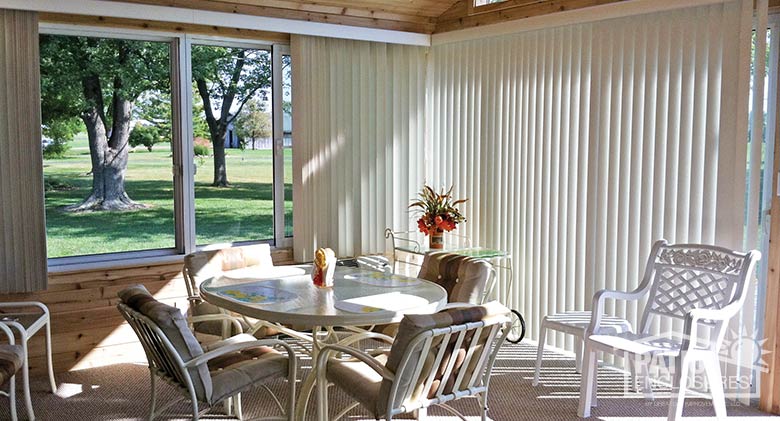White vertical blinds can be fully opened for expansive views.
