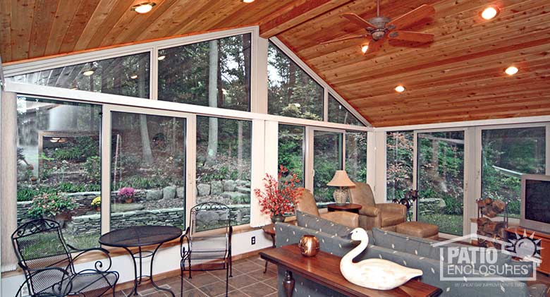 White four season sunroom with aluminum frame, solid knee wall and custom gable roof