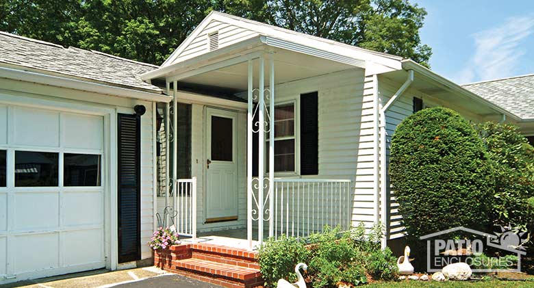 White porch cover provides protection at the front door.