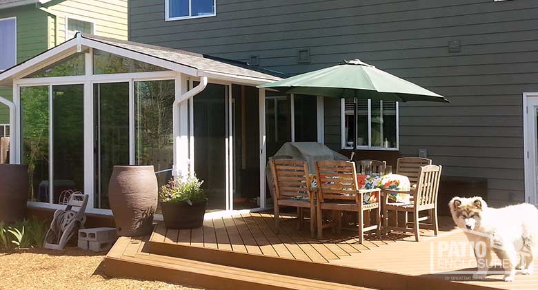 EasyRoom sunroom kit with white aluminum frame and gable roof.