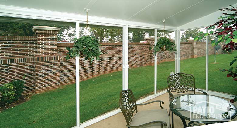 EasyRoom sunroom kit with white aluminum frame and single-slope roof.