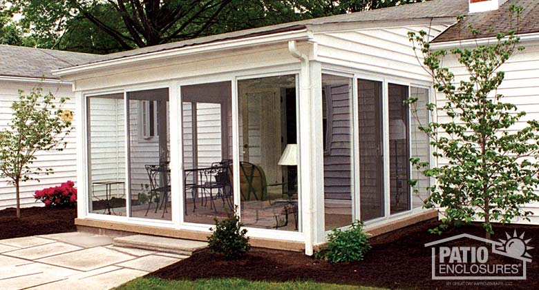 White three season sunroom with single-slope roof.