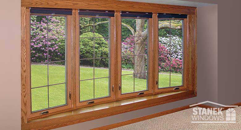Four-lite bow window with interior woodgrain finish and interior colonial grids.