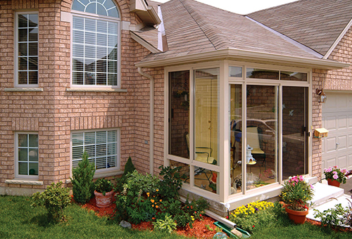 Outside View of a Small Sunroom Under Existing Roof 
