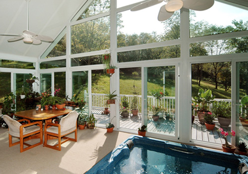 Inside View Of A Sunroom With Vaulted Ceiling and Hot Tub