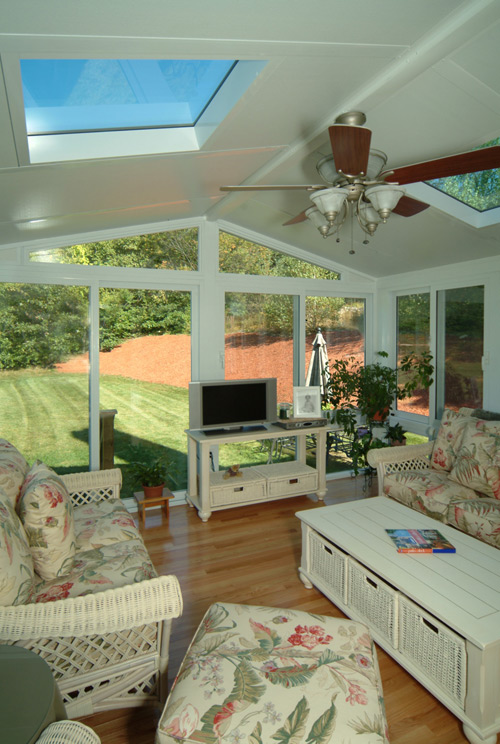 Inside View Of A Sunroom With Vaulted Ceiling and Skylights