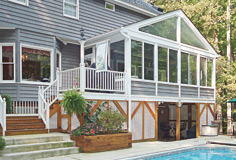 Patio Enclosures Sun Room Addition overlooking in-ground pool and patio