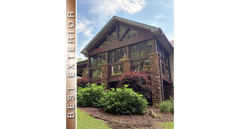 Best Exterior: Second story three-season porch enclosure with stone columns, gable roof with separated glass wings.
