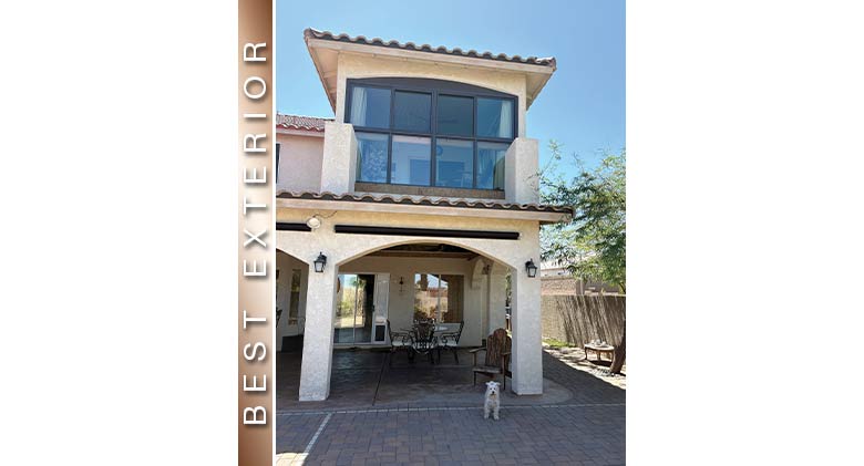 Best Exterior: Dog standing in front of a two-story home with second-floor porch enclosure with brown frame.

