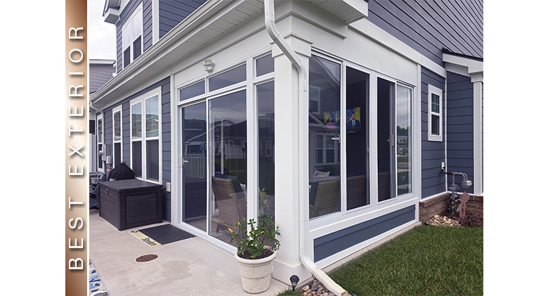 Best Exterior: A corner patio three-season room enclosure with white frame and potted plant out front.