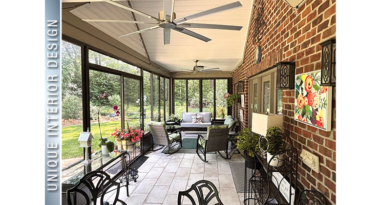 Most Unique Interior Design: Interior of patio enclosure with gable roof, ceiling fan, brick wall, & seating area on one
end.
