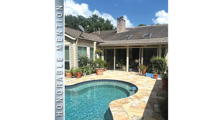 Honorable Mention: Three-season patio enclosure with sandstone frame and in-ground pool in front
