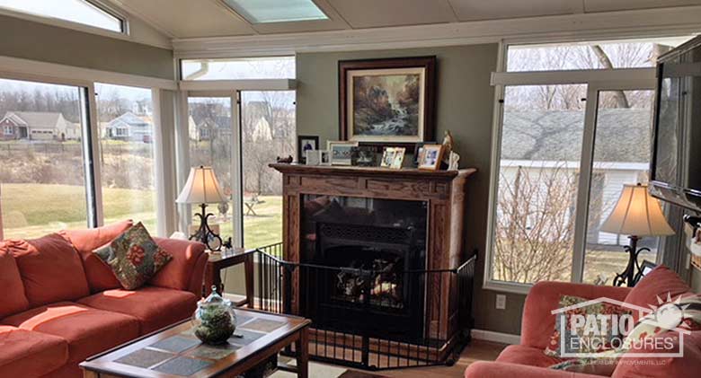 White four season sunroom with aluminum frame, transom and solid knee wall.