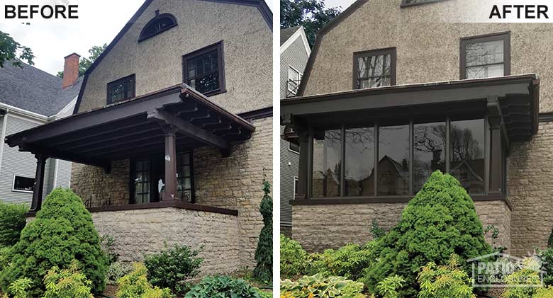 Bronze three season room with solid knee wall enclosing an existing covered porch.