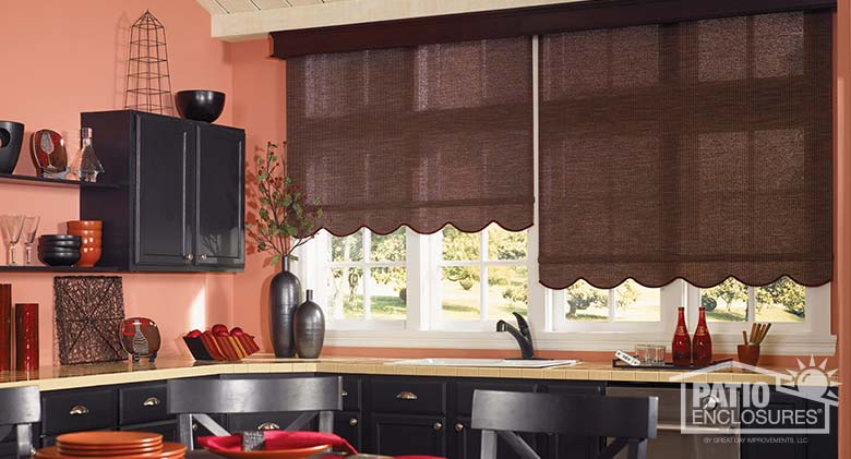Motorized roller shades in russet with regal dark cherry wood cornice.