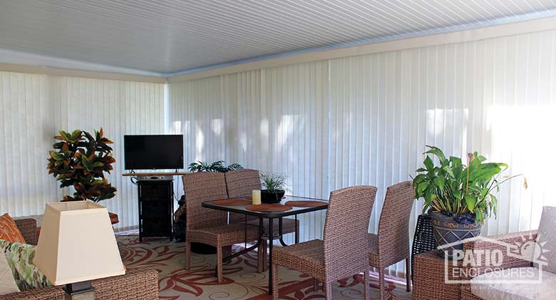 White vertical blinds provide privacy.