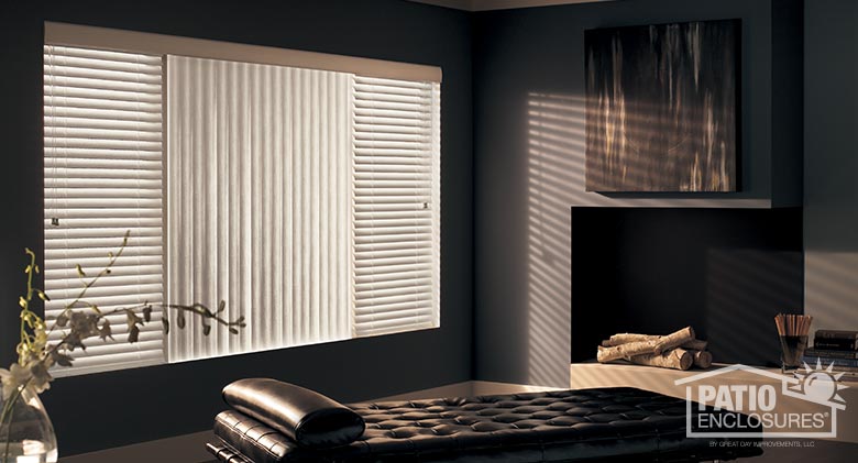 S-shaped vertical blinds with classic wood valance flanked by horizontal designer vinyl blinds.