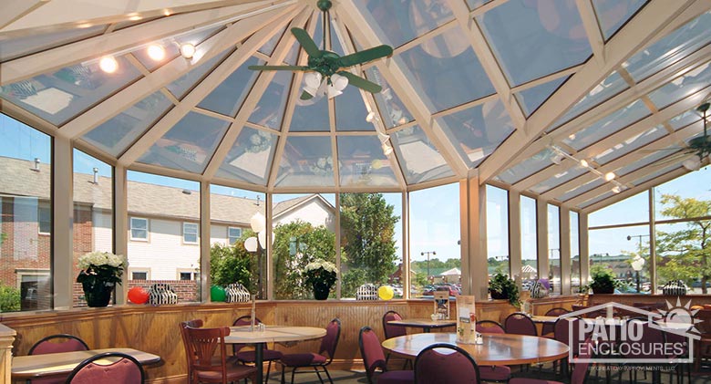 Interior of white solarium with unique roof shape in Perkins restaurant in Hudson, OH.