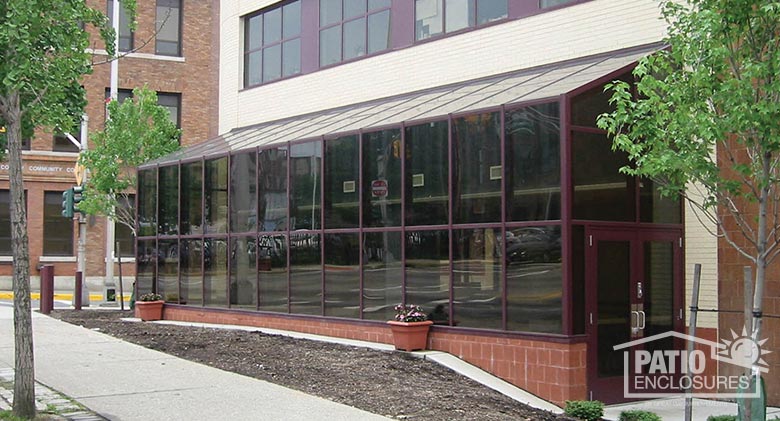 Bronze solarium with single-slope roof at Passaic County Community College in Paterson, NJ.