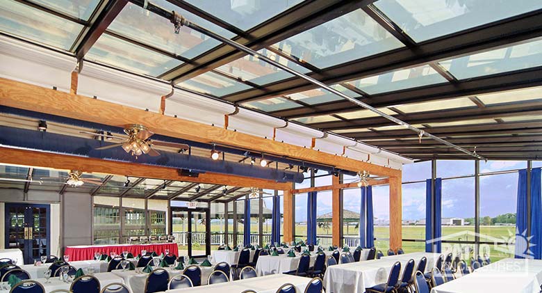 Interior of solarium in bronze with gable roof at 356 Fighter Group restaurant in Akron, OH.