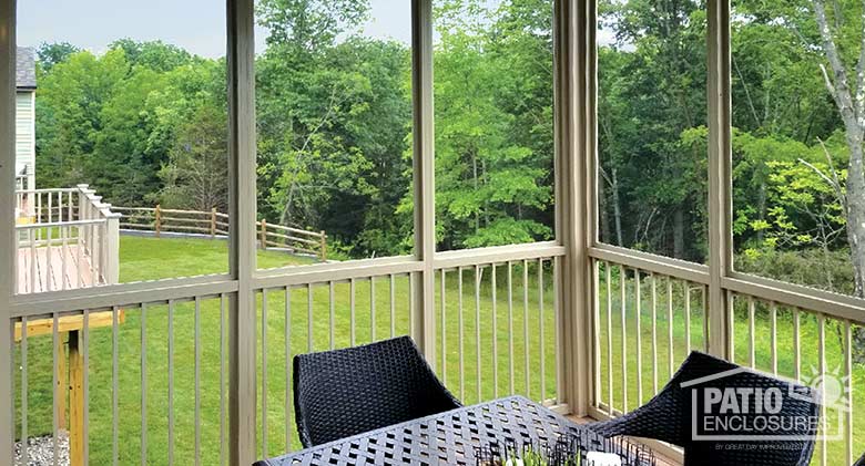 Elite three season room in sandstone with glass knee wall encloScreen room in sandstone with picket railing system enclosing an existing covered porch.