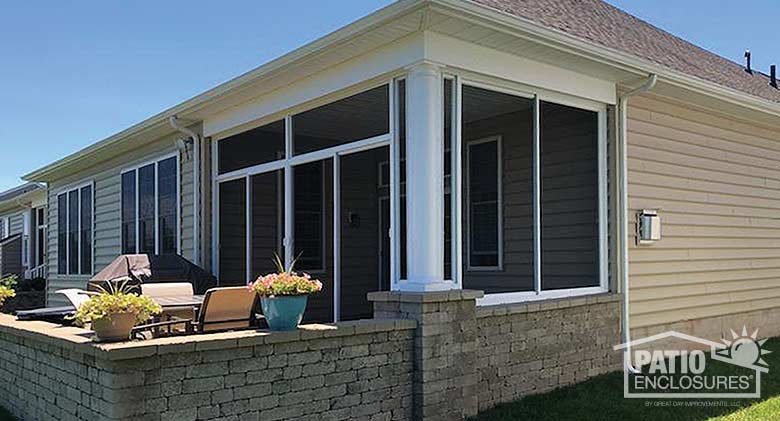 Screen room in white with transom enclosing an existing covered patio.