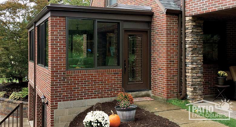 Bronze four season existing porch enclosure with aluminum frame.