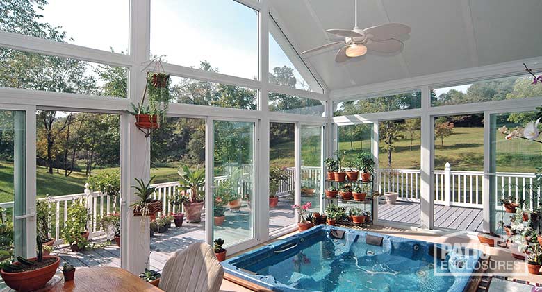 Interior view of four season sunroom with vinyl frame, transoms and gable roof.