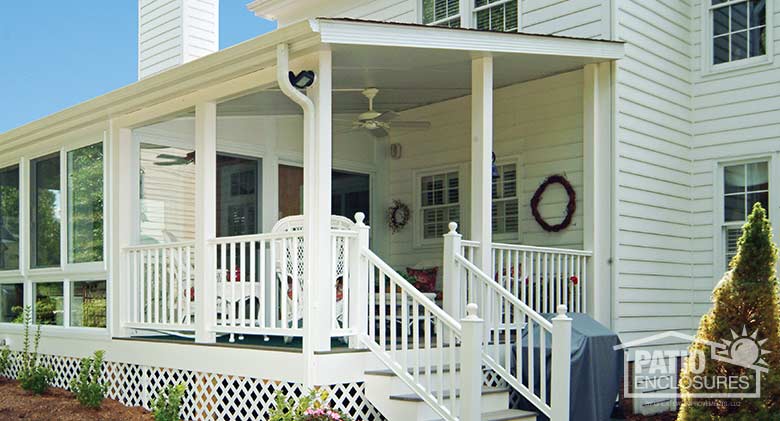 White porch cover attached to all-season sunroom.