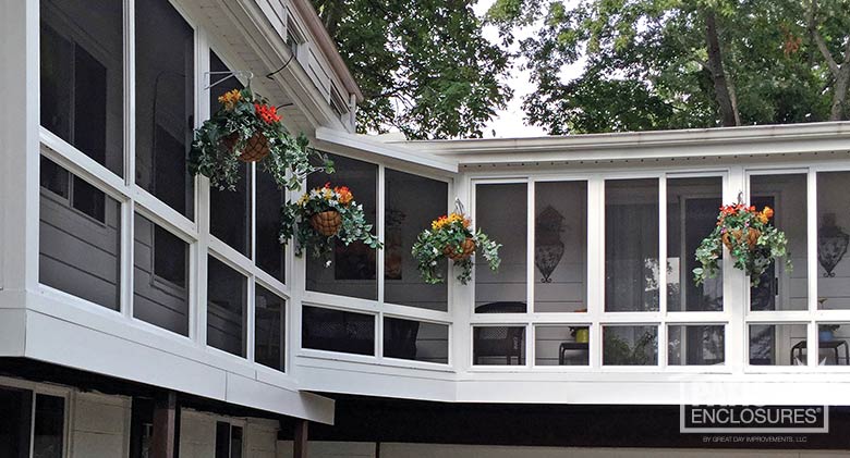 White screen room with knee wall enclosing wraparound, existing covered porch.