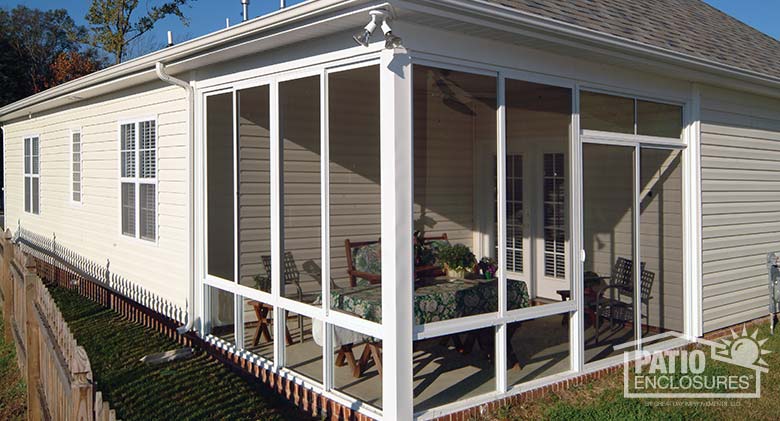 White screen room with knee wall enclosing existing covered patio