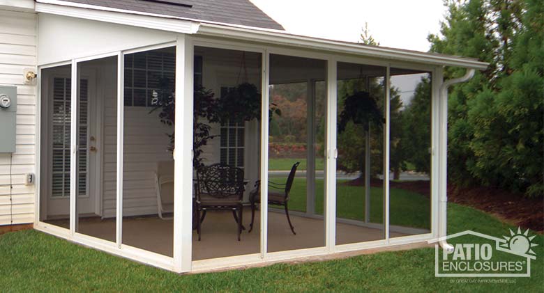 Screen room with white aluminum frame and single-slope roof.