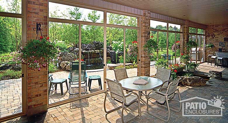 Interior view of screen room with transoms enclosing existing covered patio.