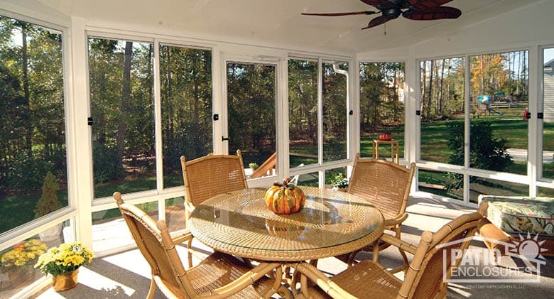 Screen room with white aluminum frame and single-slope roof.