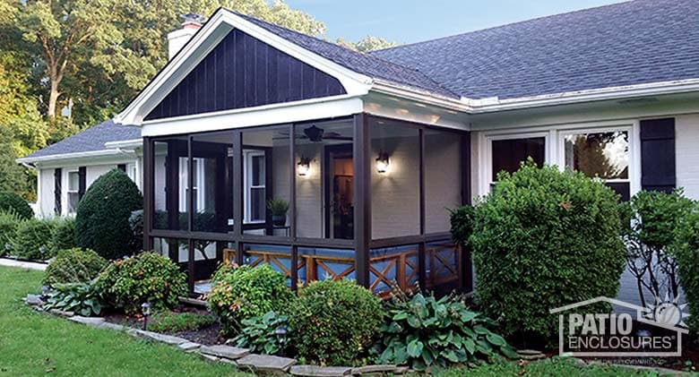 Bronze screen room with knee wall enclosing an existing front porch.