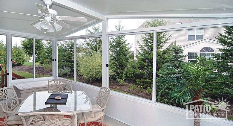 White screen room with a solid knee wall and gable roof.