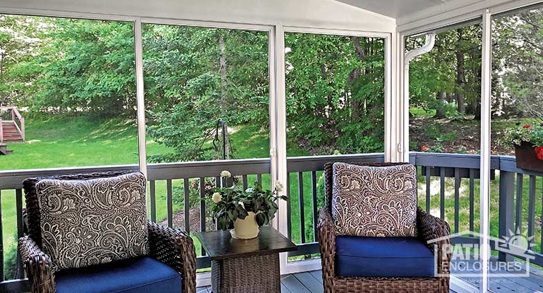 Screen room with white aluminum frame and single-slope roof.