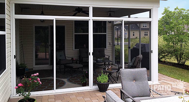 White screen room with transoms enclosing an existing covered patio.