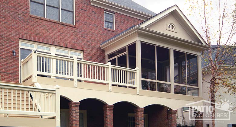 Sandstone screen room with knee wall enclosing existing covered porch.