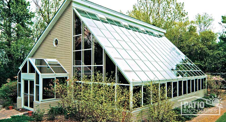 White solarium with single-slope roof.