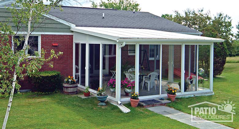 EasyRoom sunroom kit with white aluminum frame and single-slope roof.