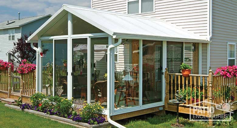 EasyRoom sunroom kit with white aluminum frame and gable roof.