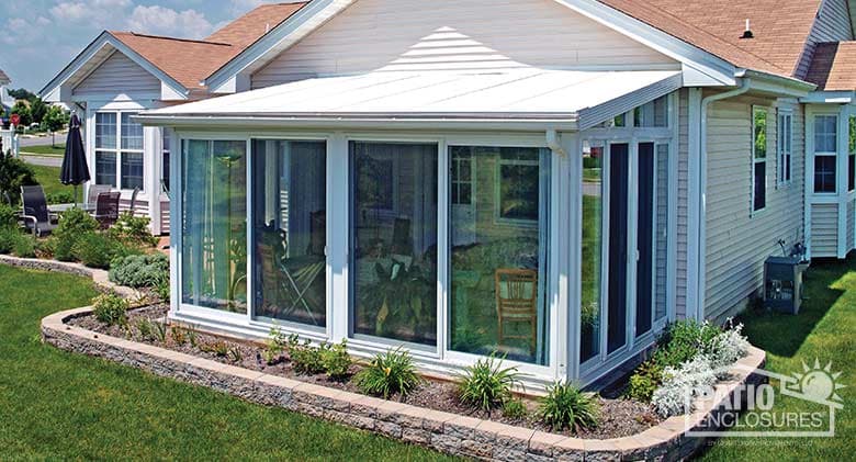 EasyRoom sunroom kit with white aluminum frame and single-slope roof.