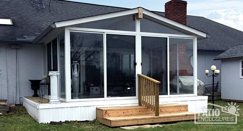 EasyRoom sunroom kit with white aluminum frame and gable roof.