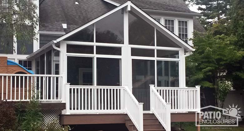 Elite three season room with insulated glass, transoms and shingled gable roof.