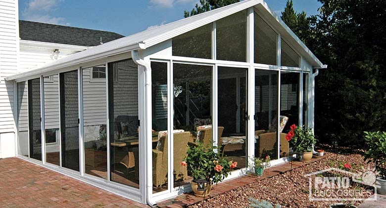 White three season room with insulated glass and gable roof.