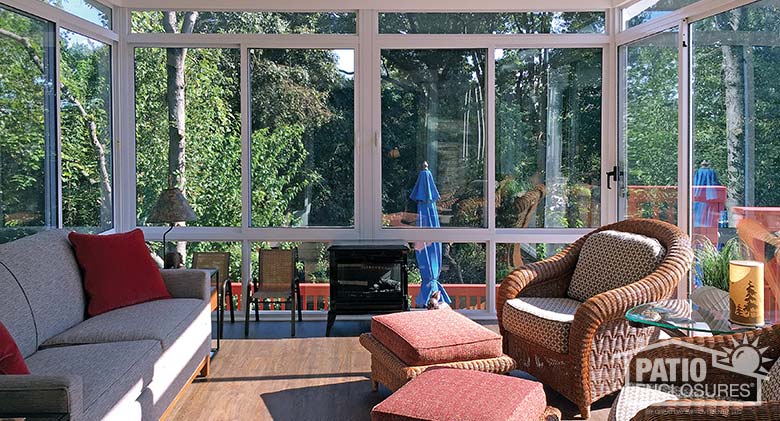 Elite three season sunroom with insulated glass enclosing an existing covered porch.