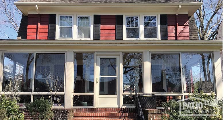 Sandstone elite three season room enclosing an existing front porch.